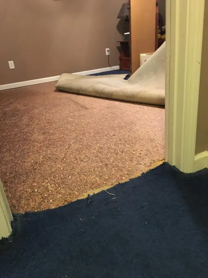 Carpet pad removal revealing water damage during Drying & Dehumidification in Oceano